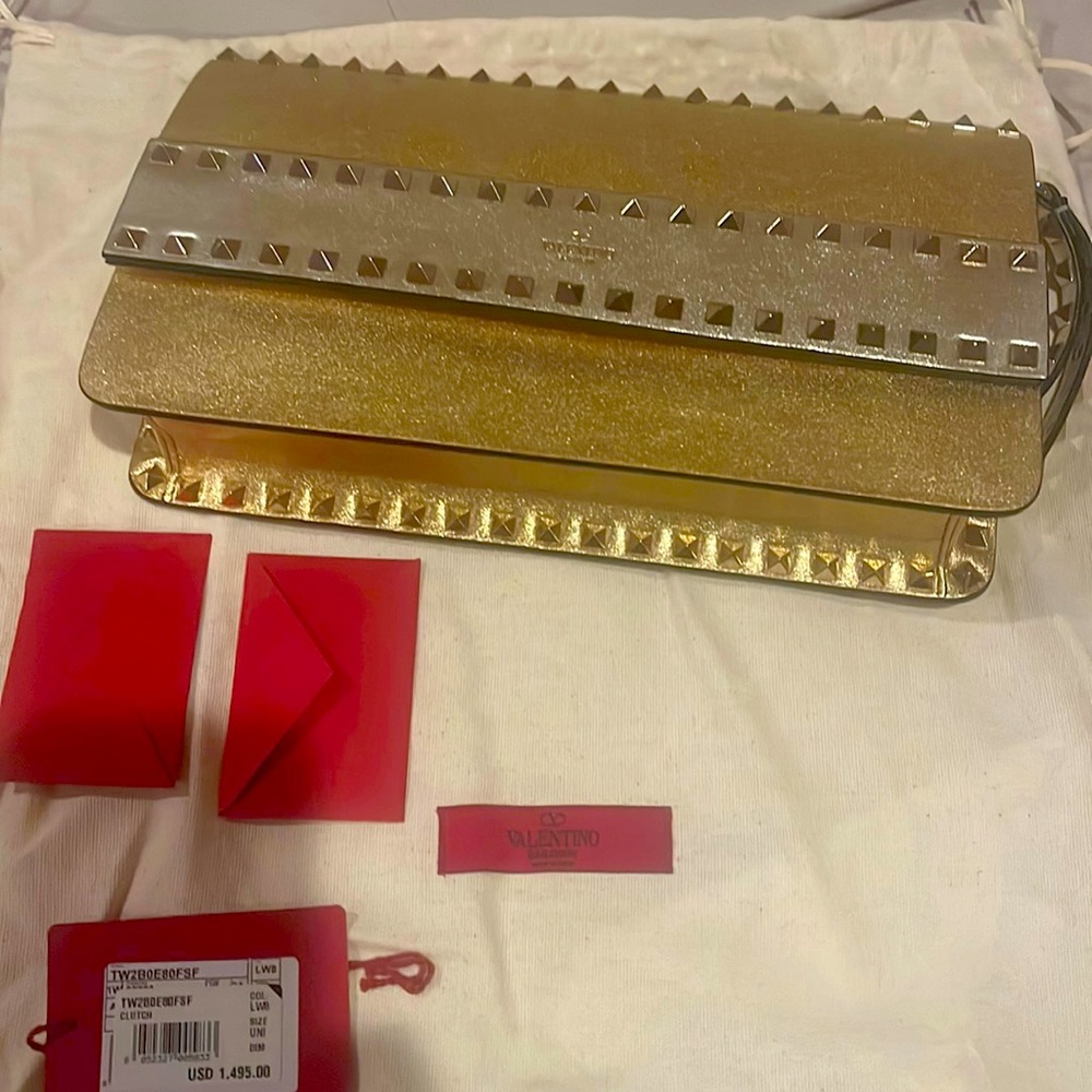 New with tags not attached. Valentino clutch bag gold and silver studs